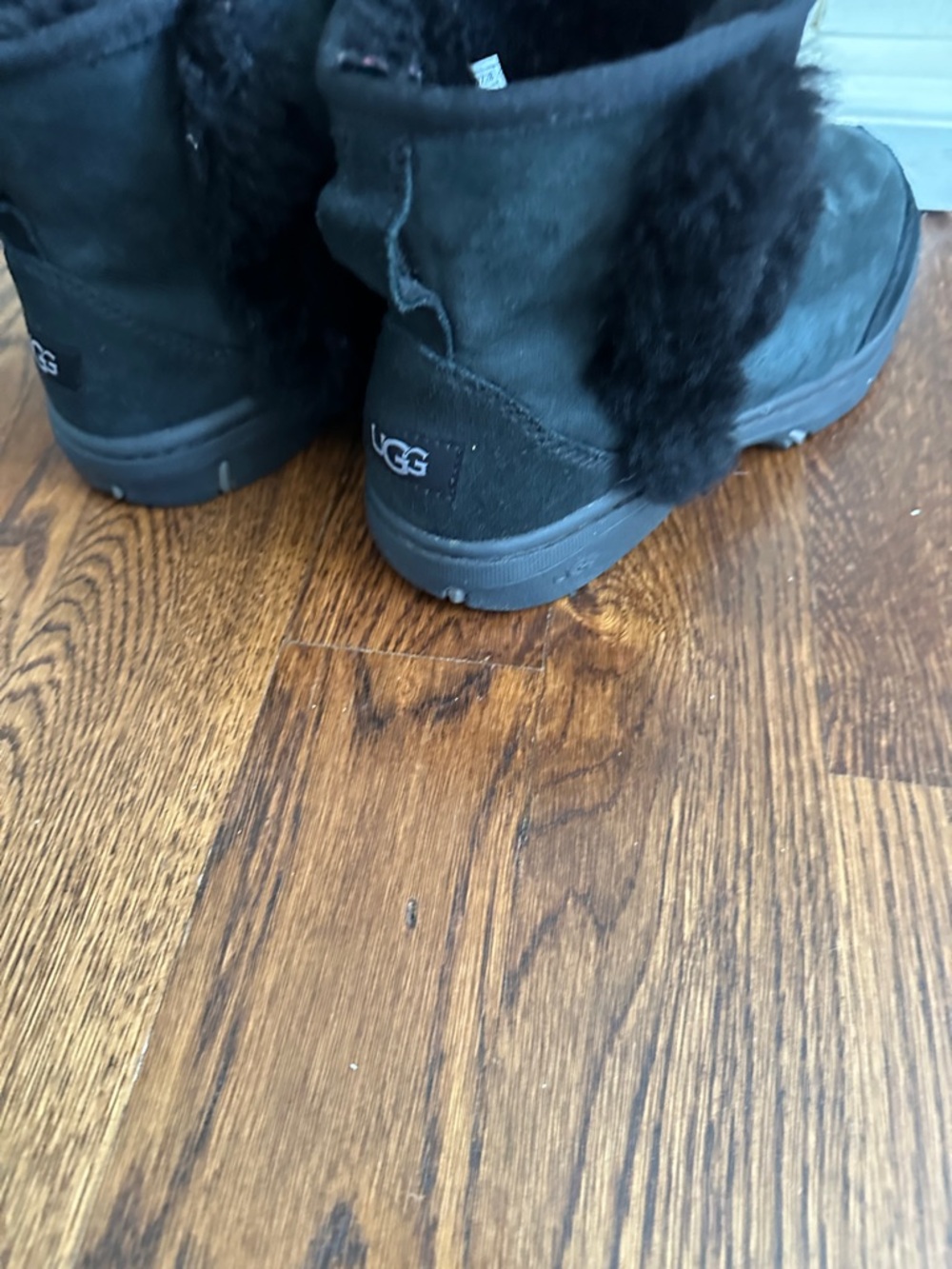 UGG Black Short Shearling Boot with Pom Detail - Picture 3 of 10